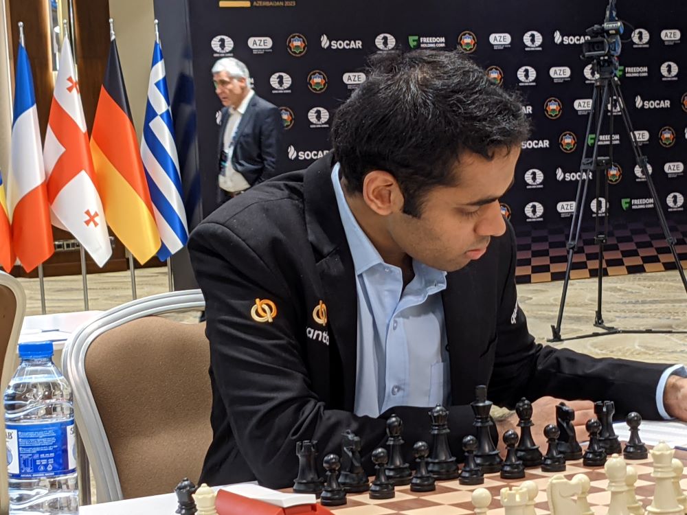 Arjun Erigaisi defeats Wang Hao with the black pieces during the