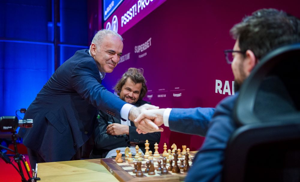 Grand Chess Tour on Instagram: Two World Champions! Garry Kasparov made  the first symbolic move in the game Ding Liren vs MVL, which finished in a  draw today. #grandchesstour #SuperbetChessClassic #chess  #worldchesschampion #